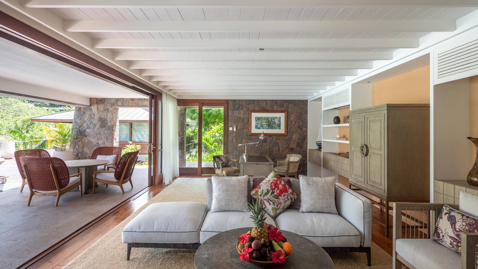 Living room with entire wall open to outdoor terrace