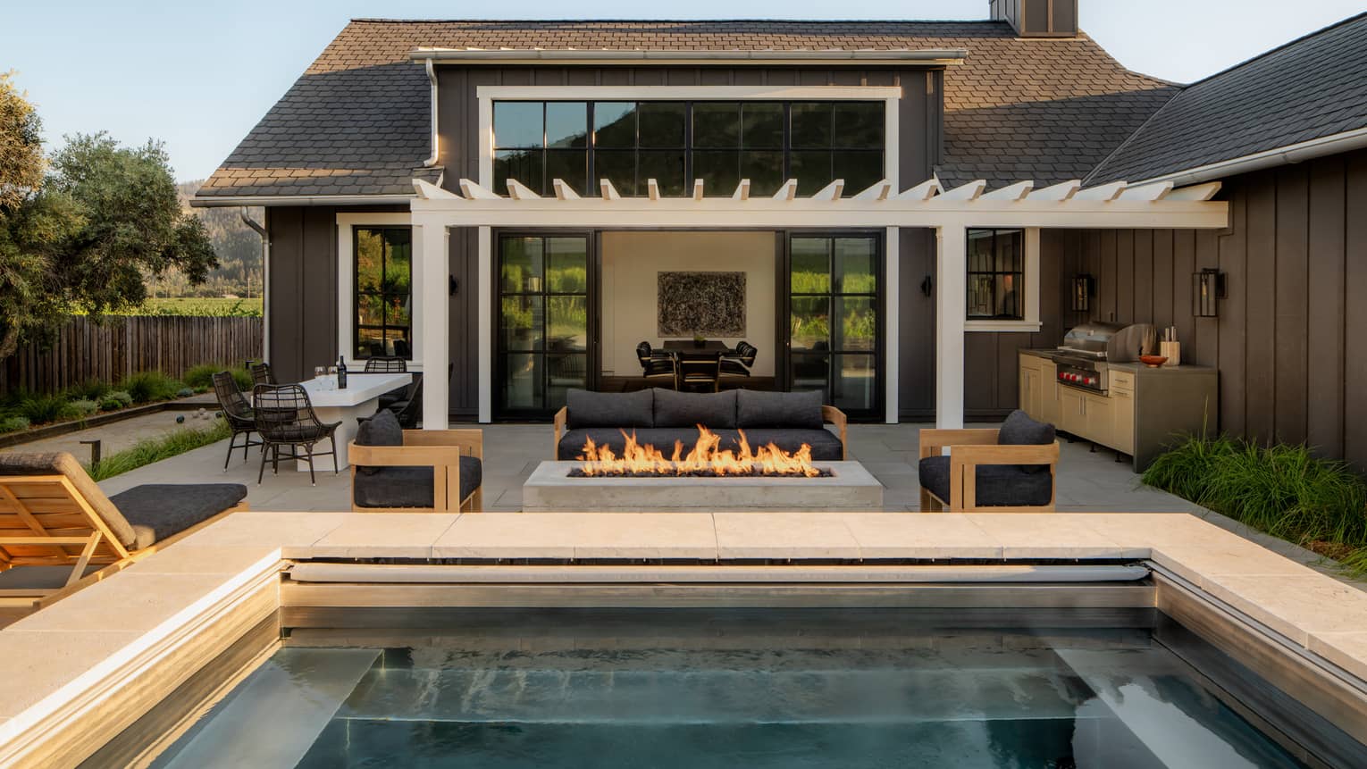 Private residence terrace with gas fire pit, pergola and pool
