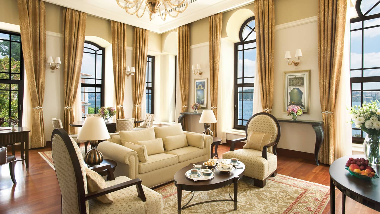 Two-Bedroom Bosphorus Palace Suite elegant seating area, ivory curtains on corner windows