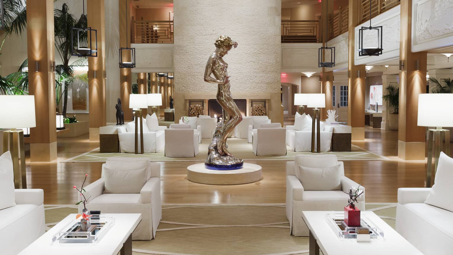 A sculpture of a woman stands in the middle of Sensei Lanai, A Four Seasons Resort lobby