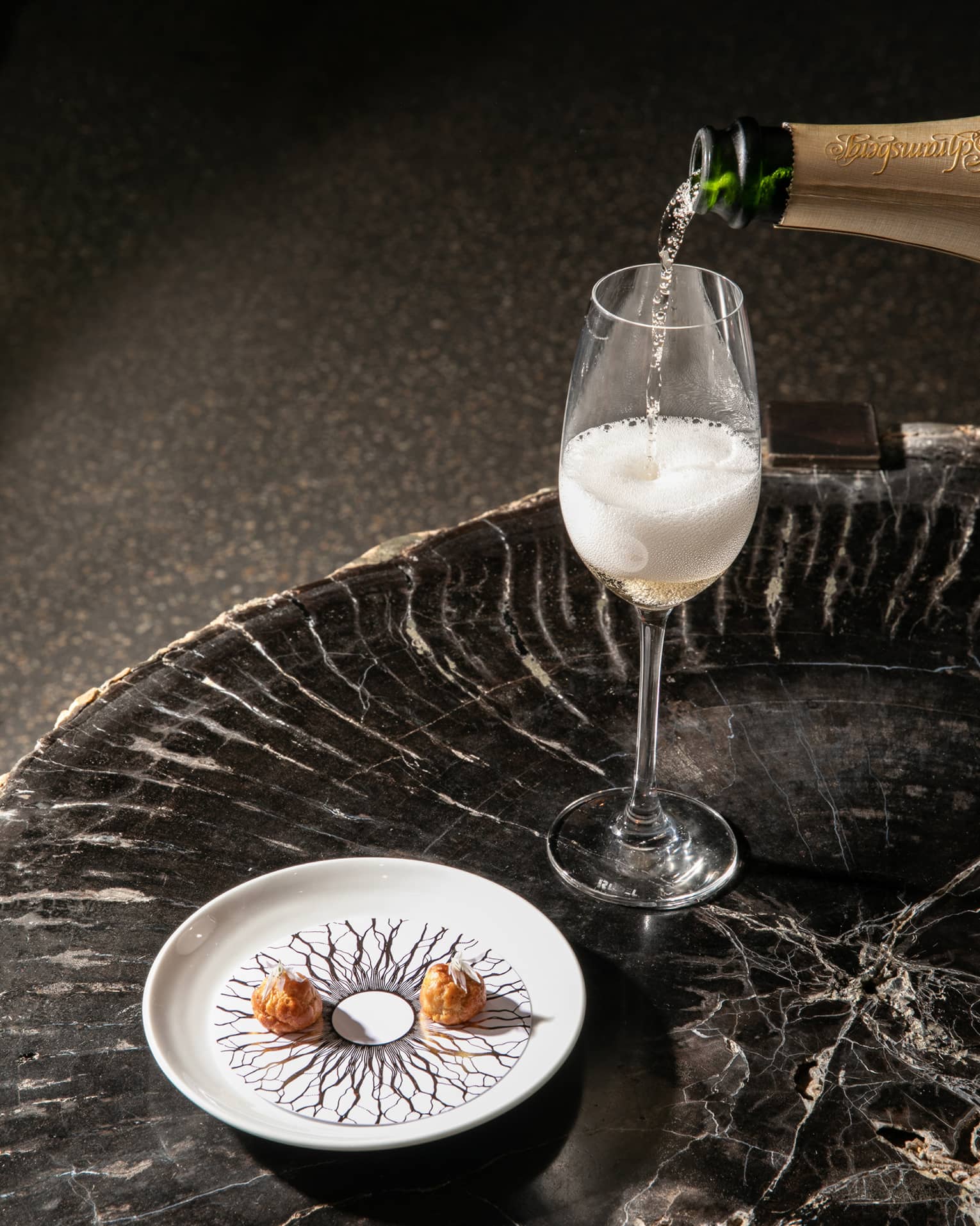Champagne being poured into a glass.