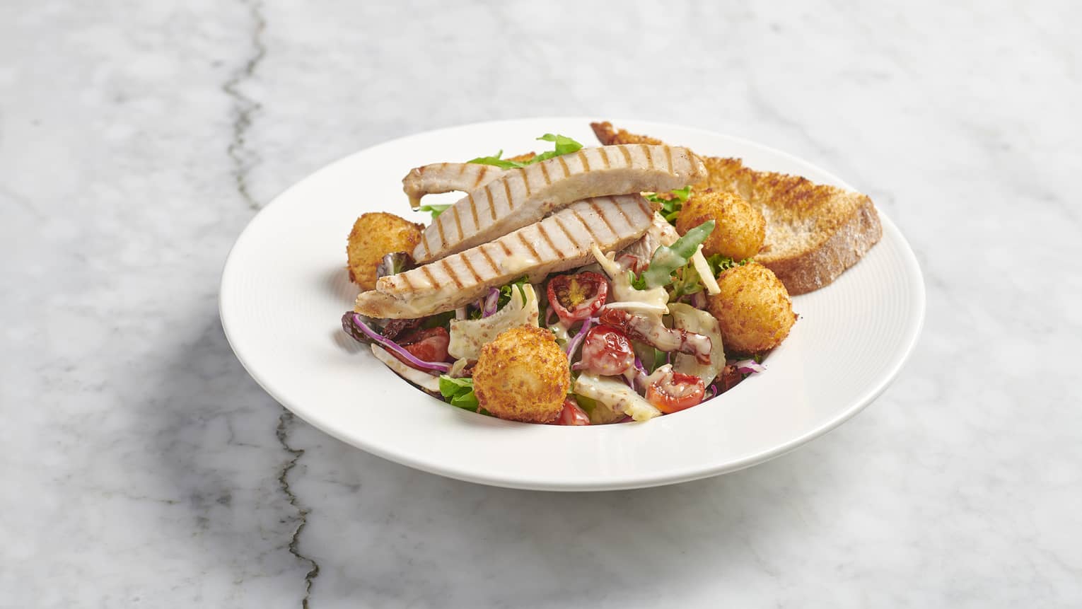 Field Greens, Roasted Chicken, Fried Goat Cheese, Artichoke, Sun-dried Cherry Tomatoes, Red Cabbage, Mushrooms, Honey Mustard Dressing