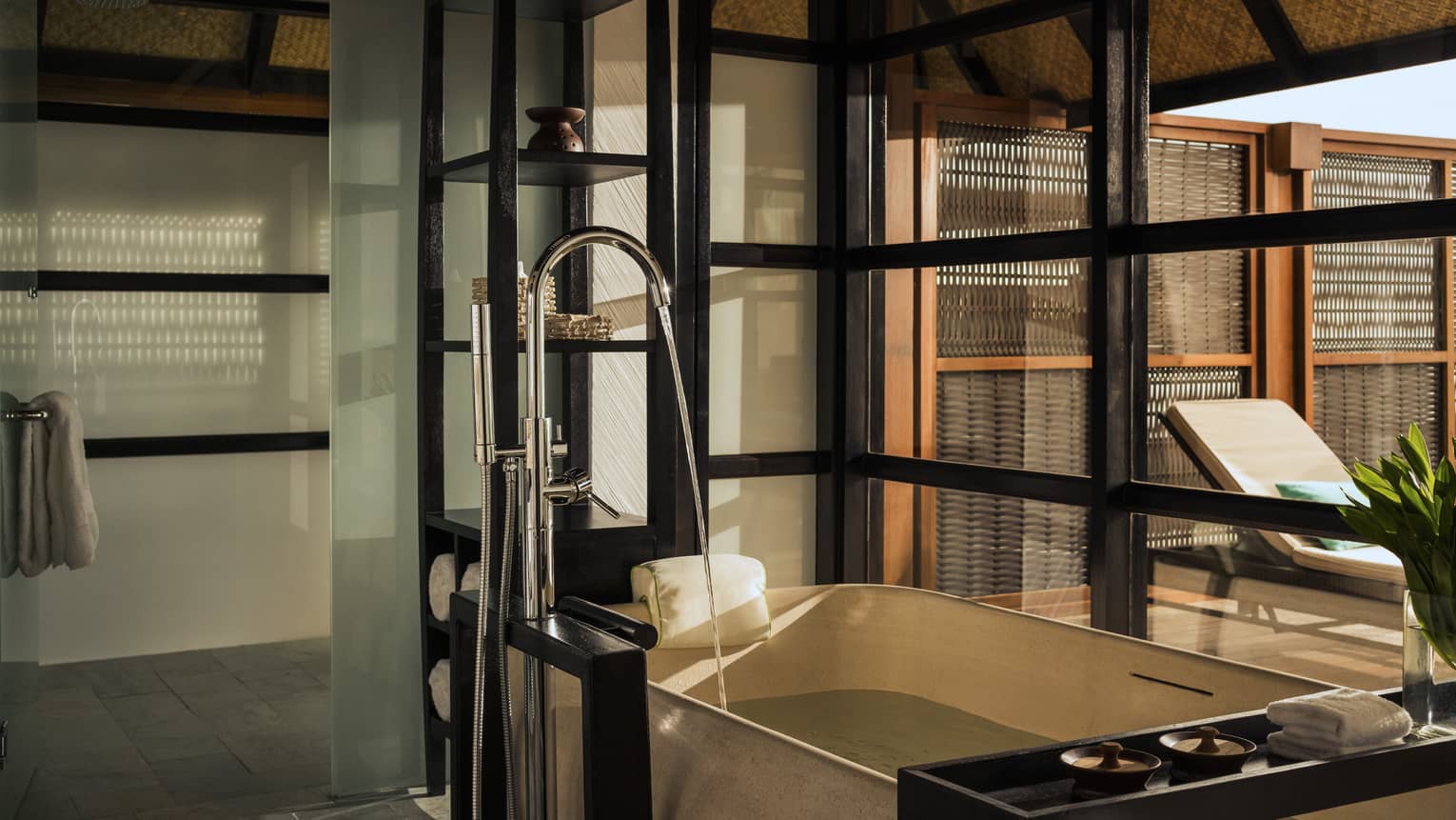 Luxury bathroom in a sunset water villa with pool