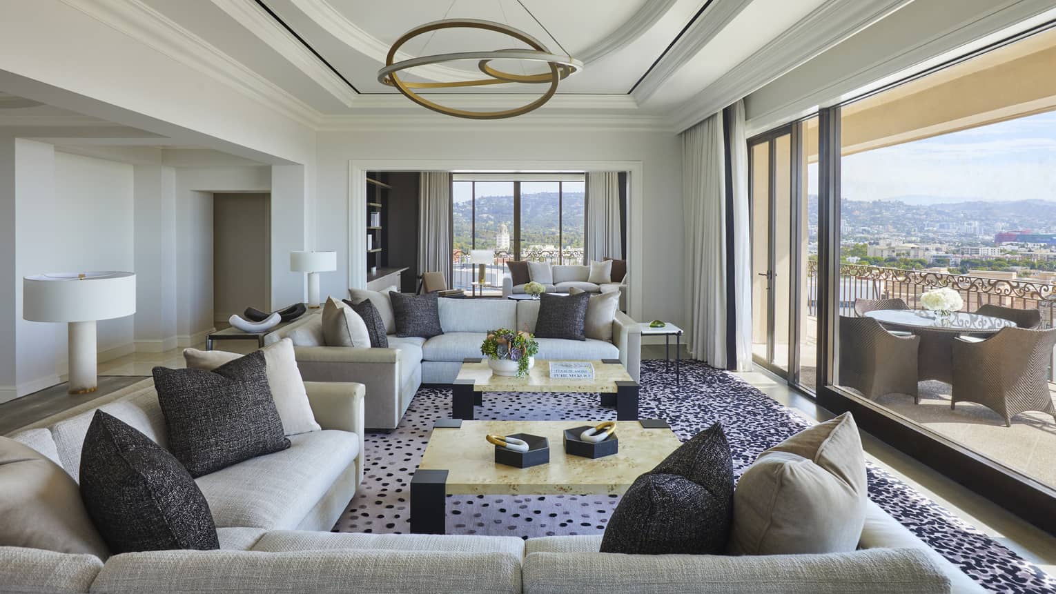 Large living room opening to city-view terrace