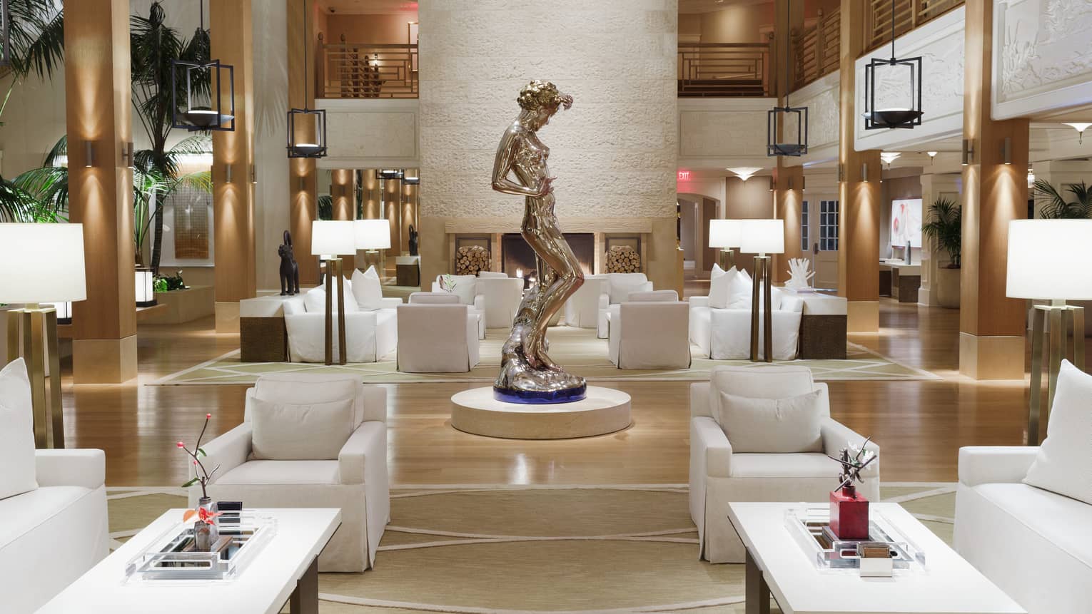 A sculpture of a woman stands in the middle of Sensei Lanai, A Four Seasons Resort lobby