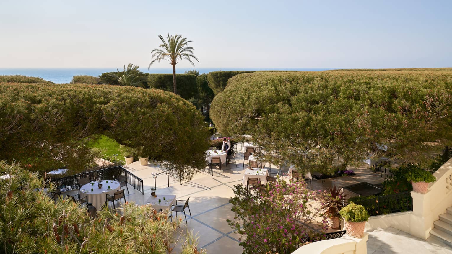 Bird’s-eye view of outdoor fine dining at luxury hotel