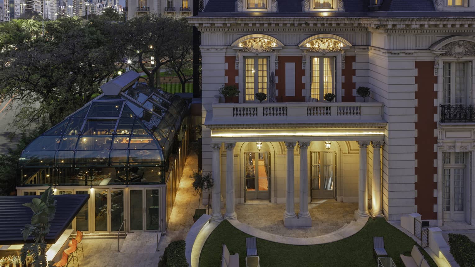 Exterior view of red-and-white building at twilight