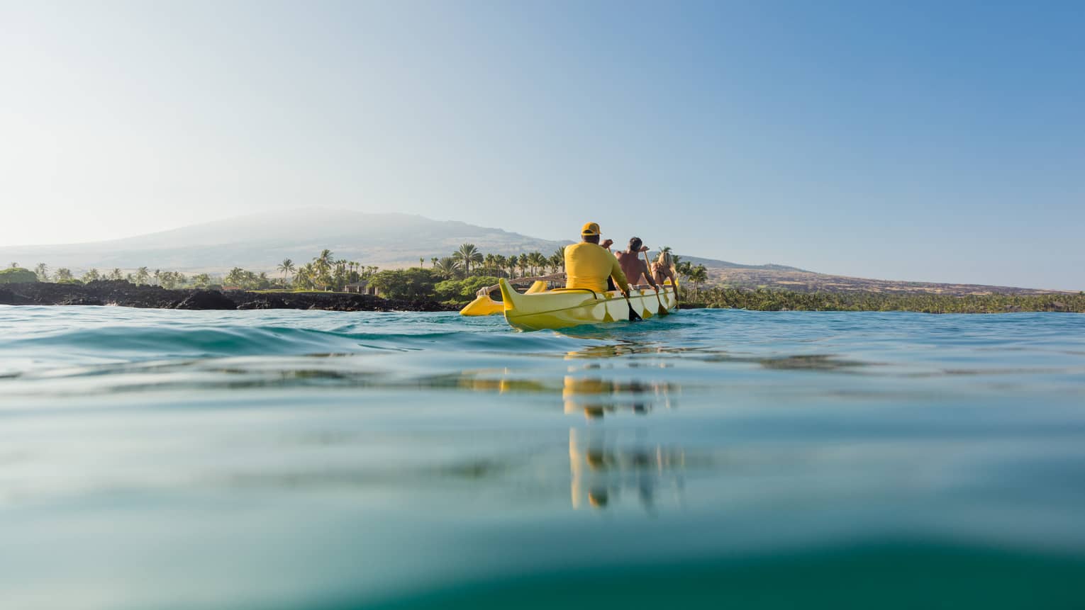 A group of guests take a canoe out on the water
