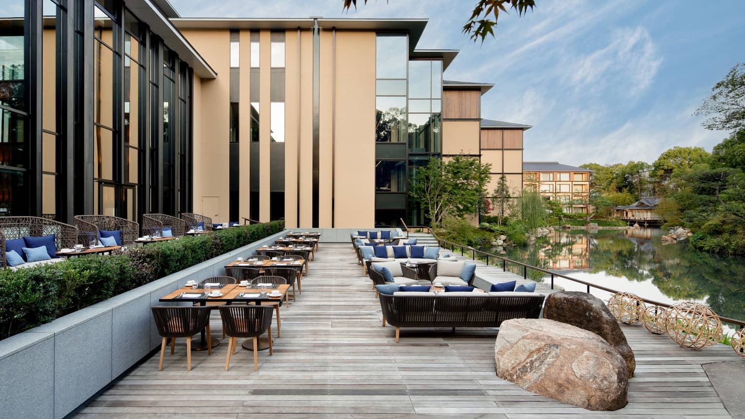 Tables, chairs and large rock on Brasserie Terrace