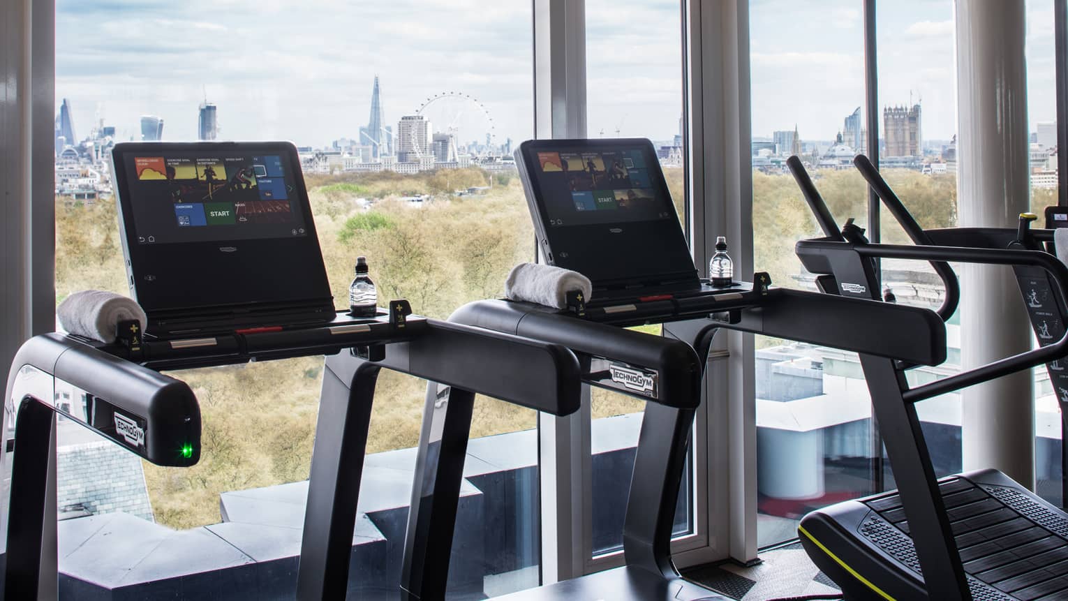 Treadmills along sunny window it Fitness Centre