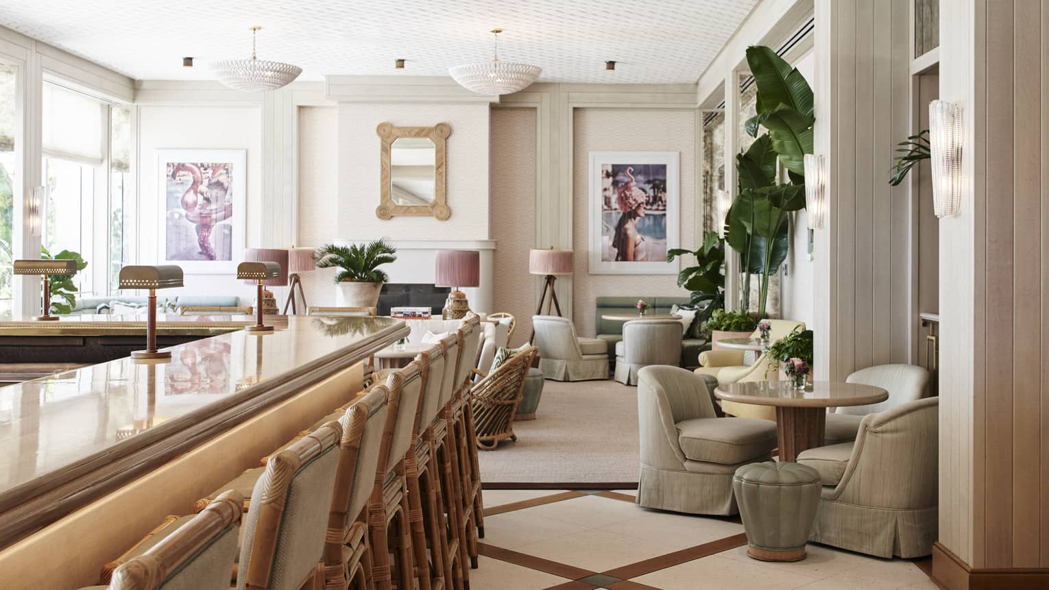 A seating area with plush chairs and round tables next to a wood bar.