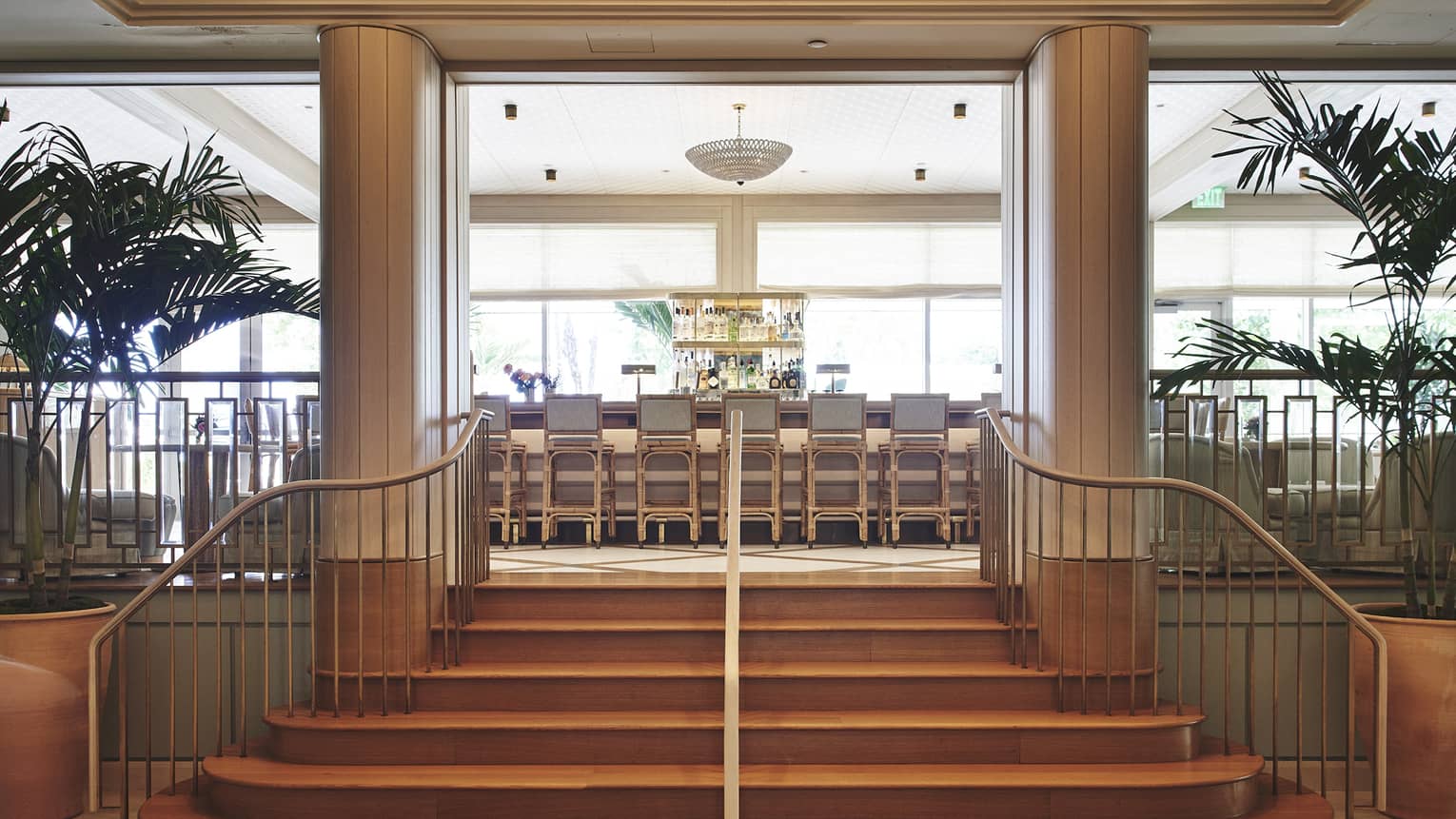 Stairs leading up to a bar area of a restaraunt.