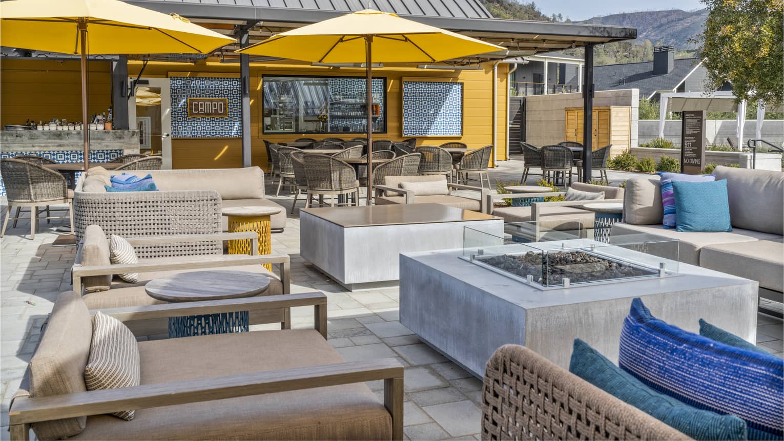 Outdoor terrace and lounge seating at Campo Poolside at Four Seasons Resort and Residences Napa Valley