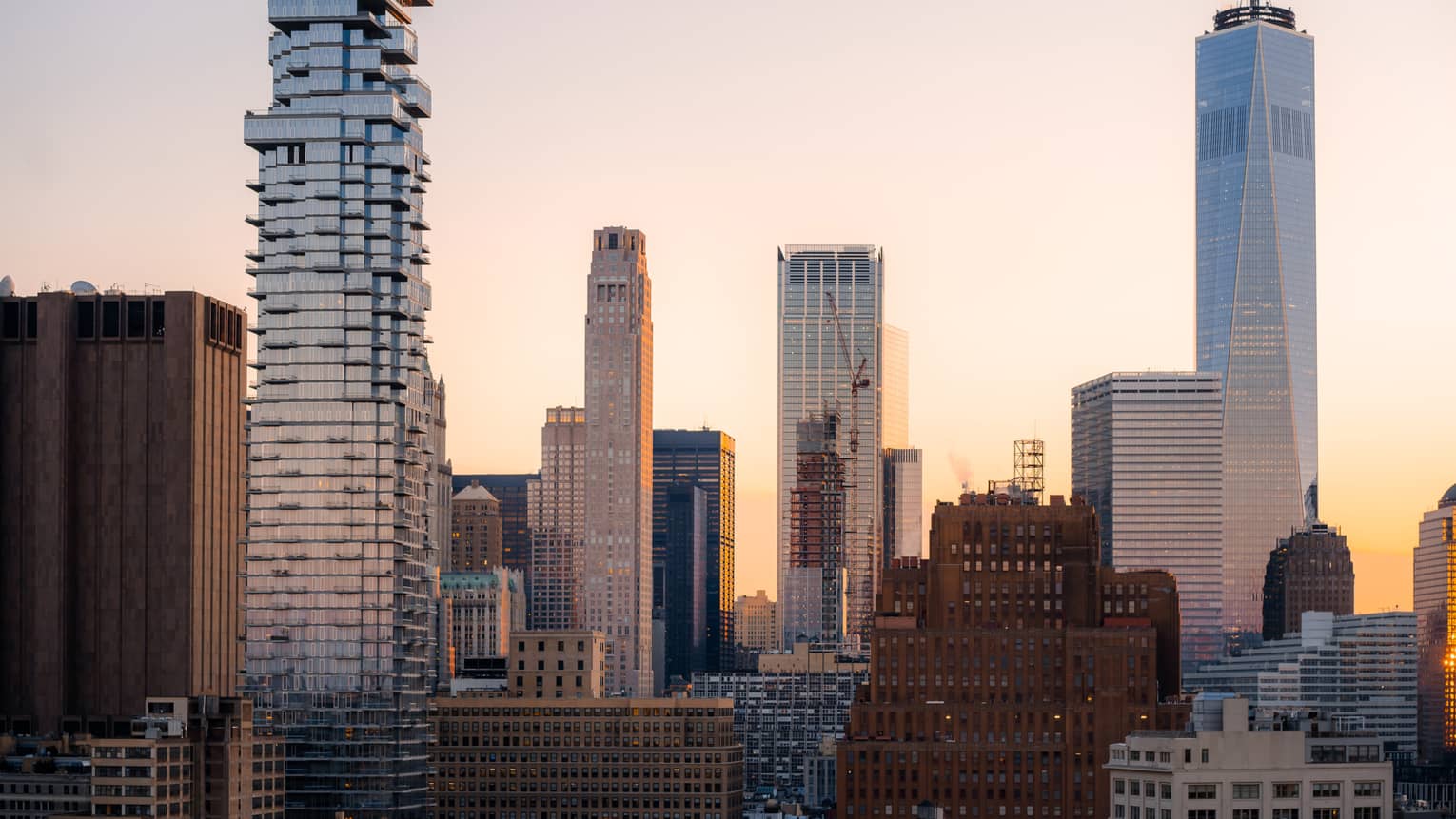 Skyscrapers in front of a sunrise.