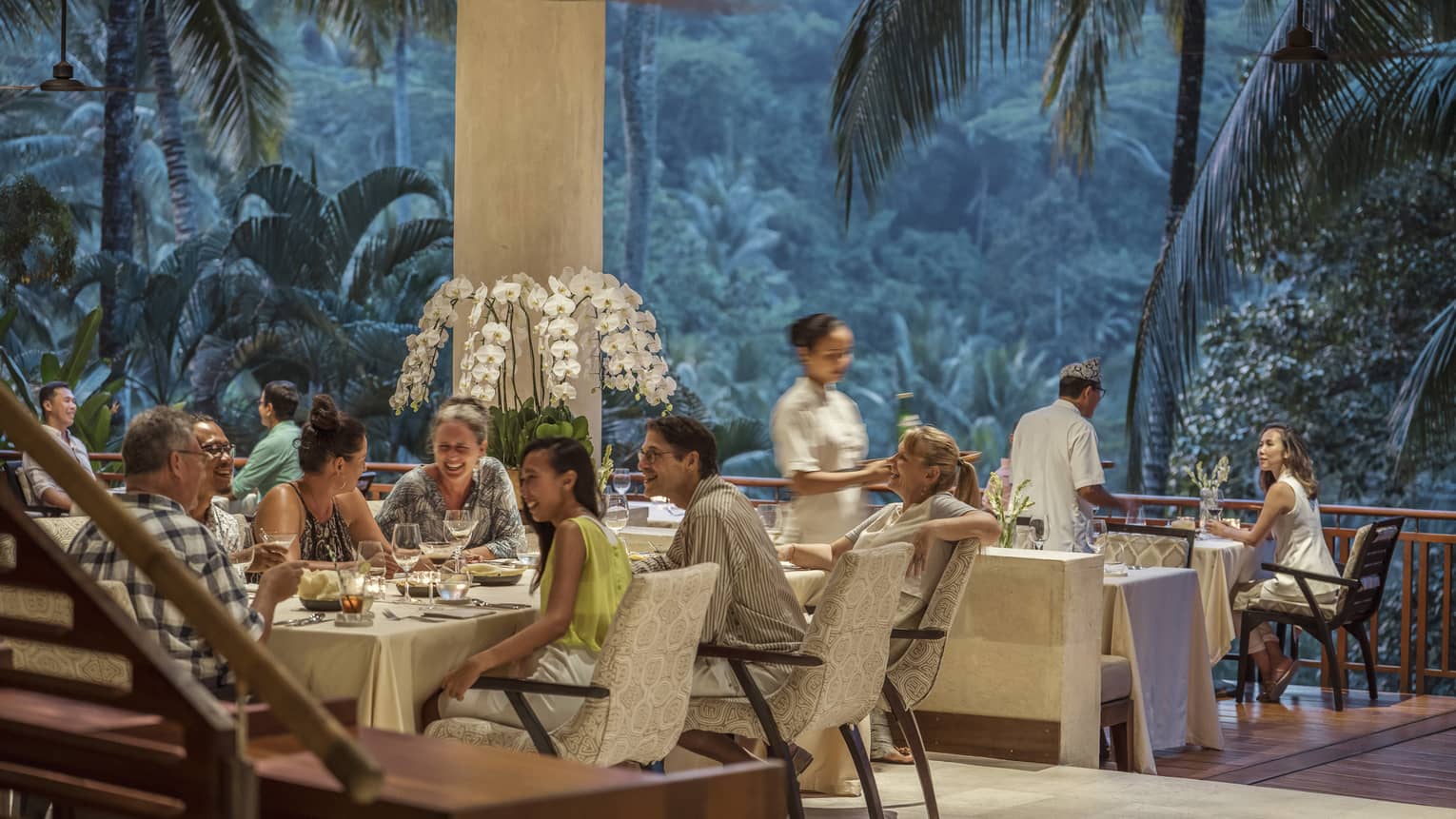 Ayung Terrace open air restaurant dining room surrounded by large palms