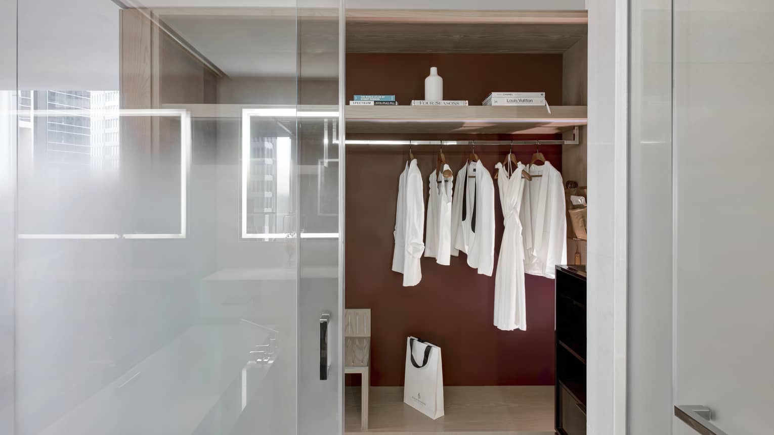 Bathroom opening to a closet