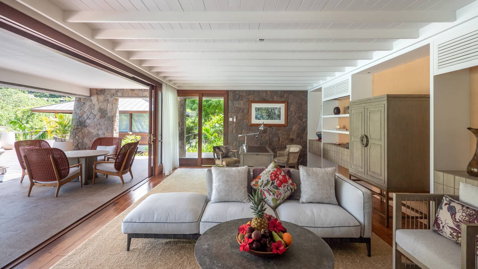 Living room with entire wall open to outdoor terrace