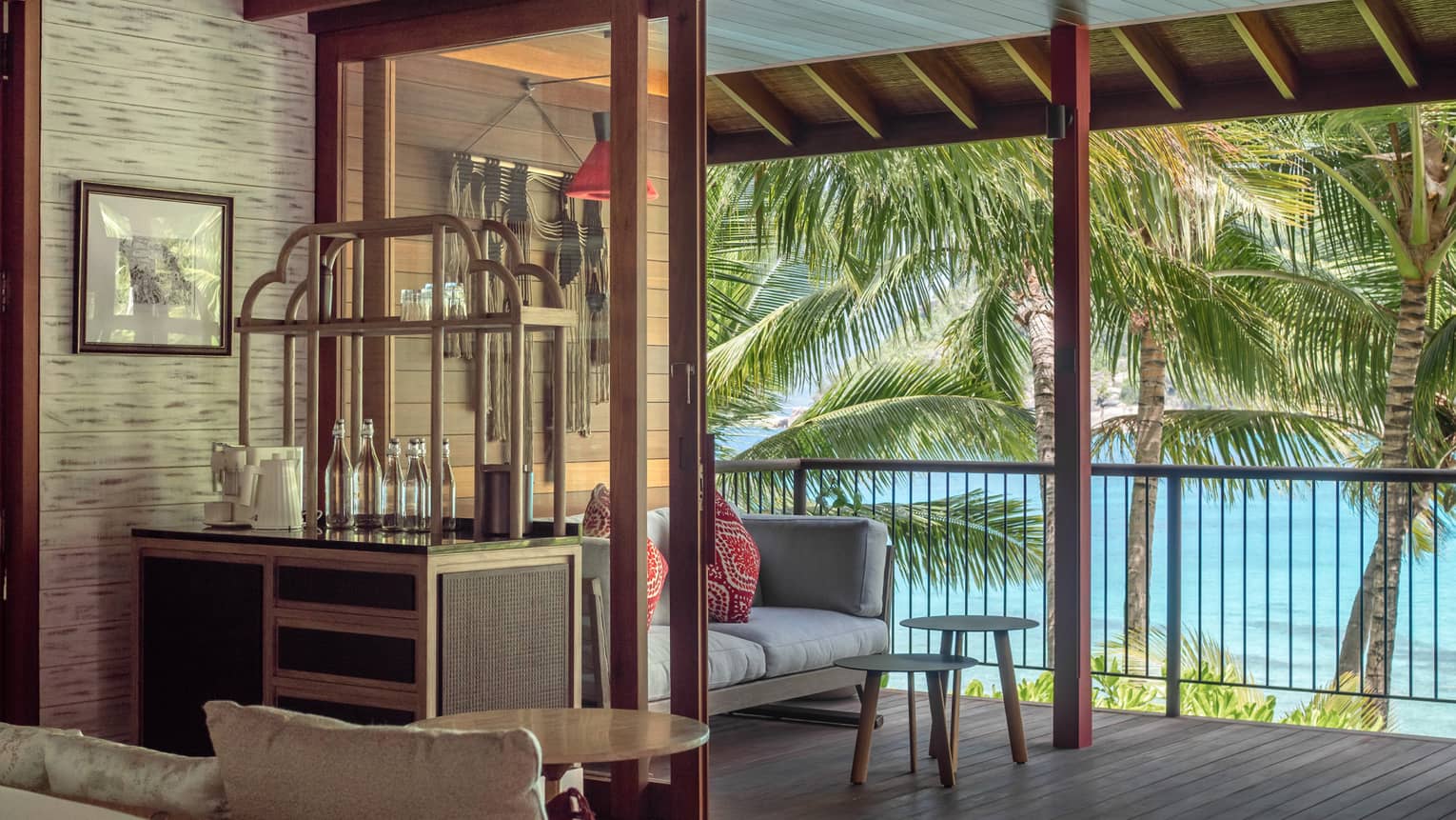 Private terrace of a bedroom, with a sofa and tropical sea views