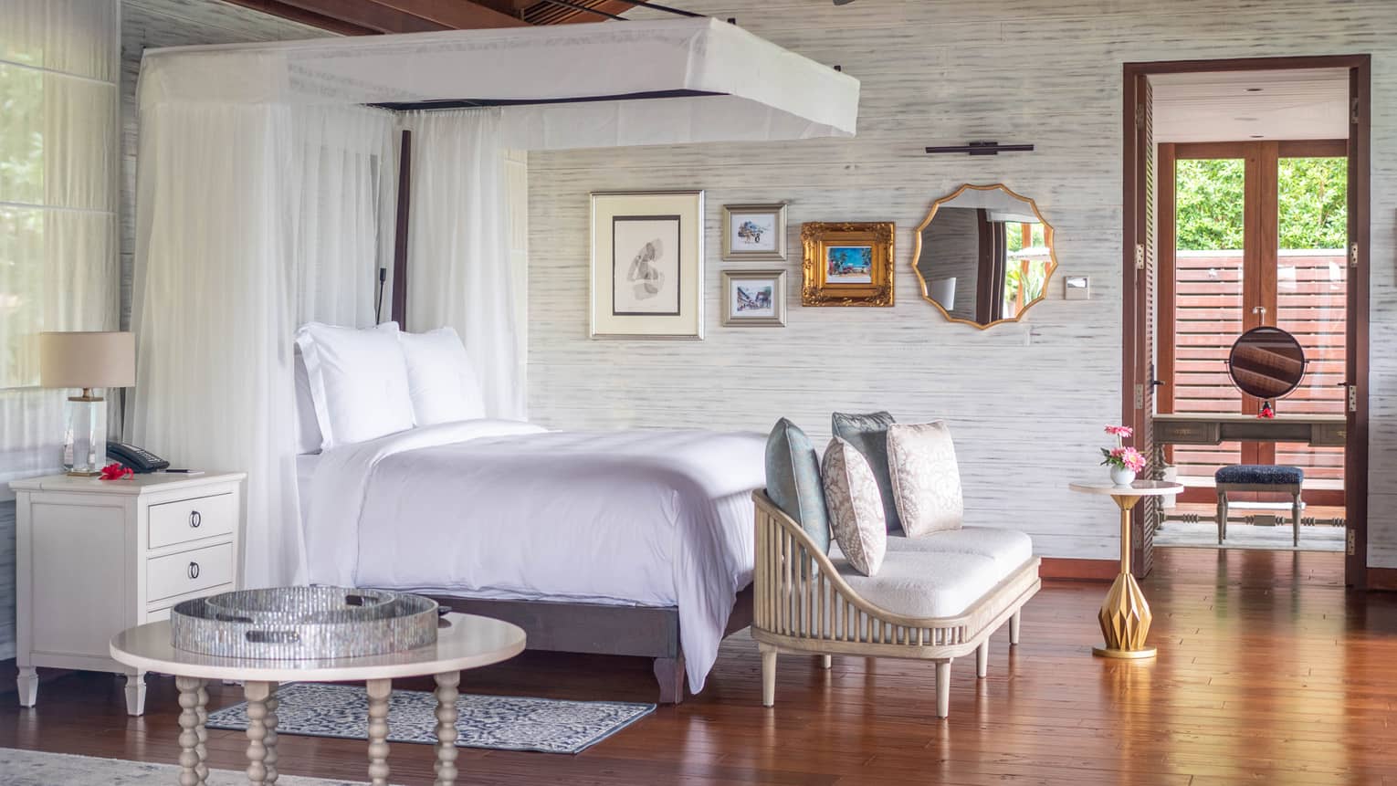 Bedroom with canopy bed and vaulted wooden ceiling