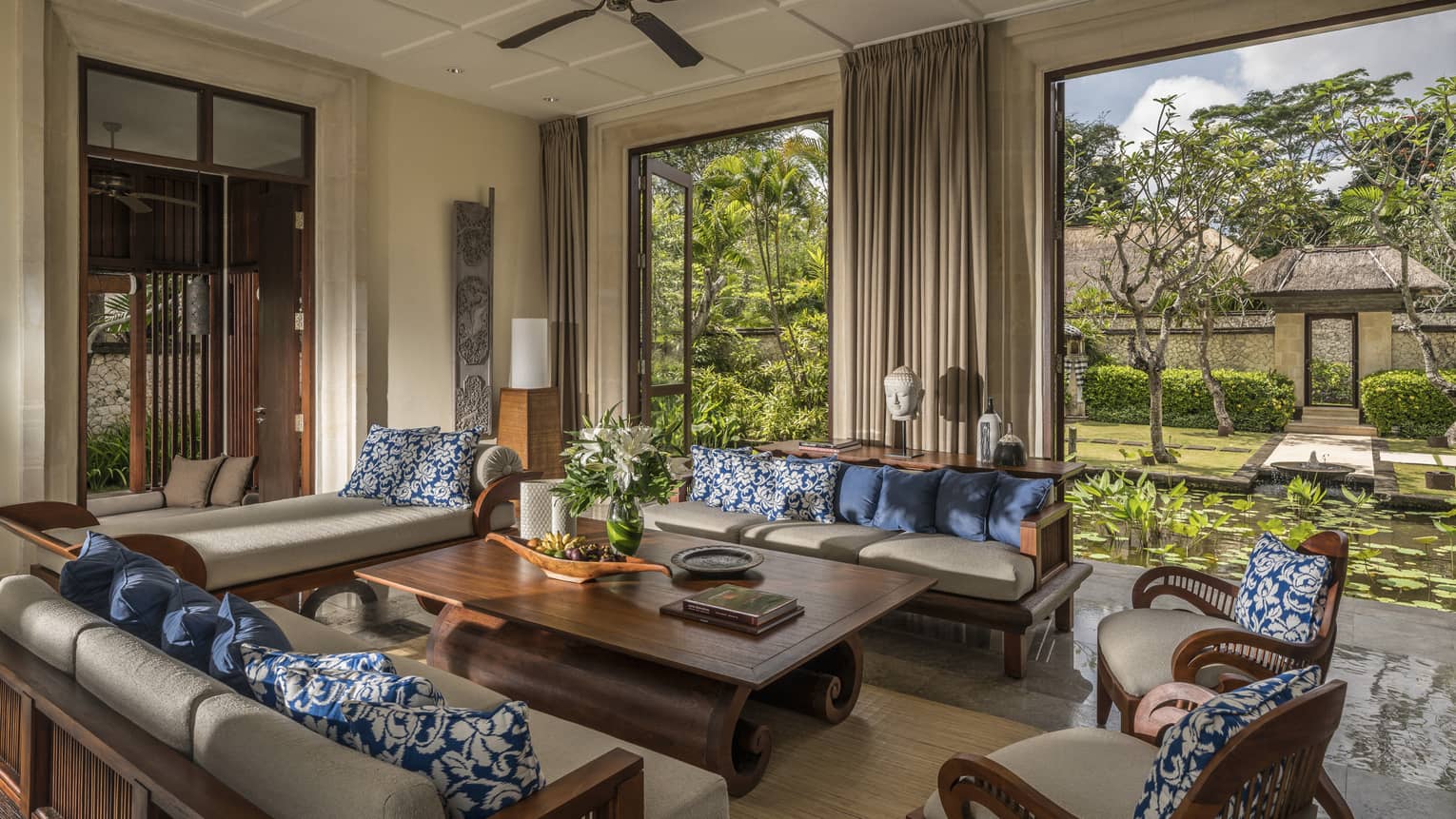 Sofas, table in open-air three-bedroom garden residence villa living room