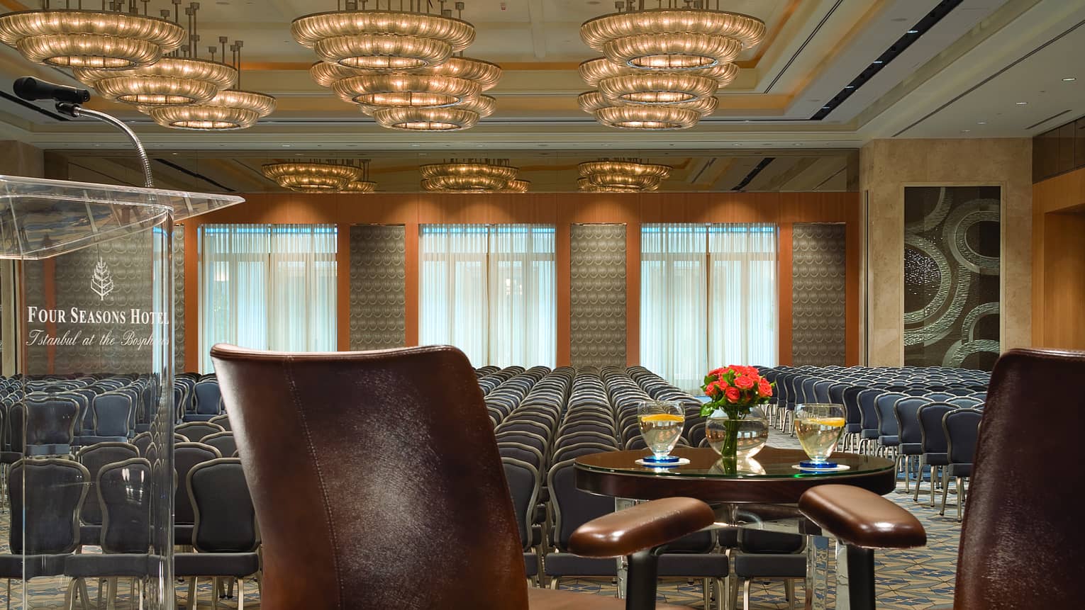 View past conference stage to rows of chairs in large Atik Pasha Grand Ballroom