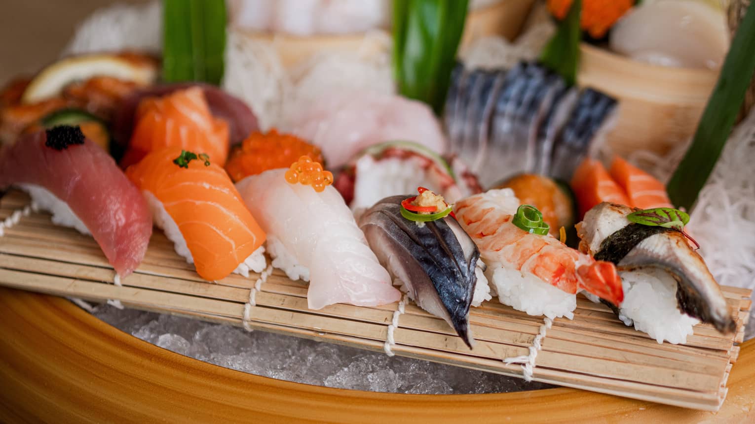 An assortment of sushi on ice.