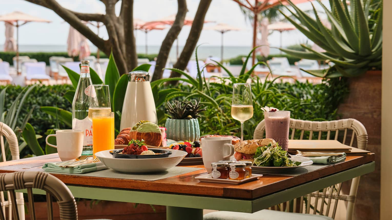 Dining table set with brunch on an open-air restaurant terrace