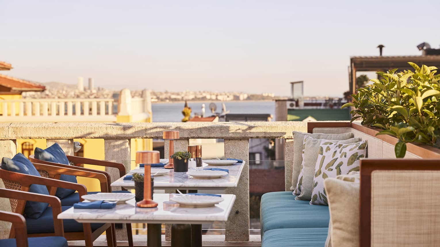 Sea-view terrace dining and accommodations at luxury hotel