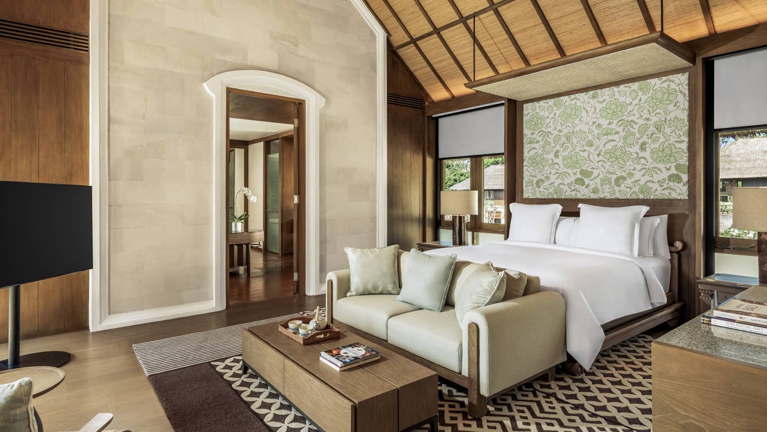 Luxury bedroom with king bed and vaulted ceiling in a private residence at at Four Seasons Resort Bali at Jimbaran Bay