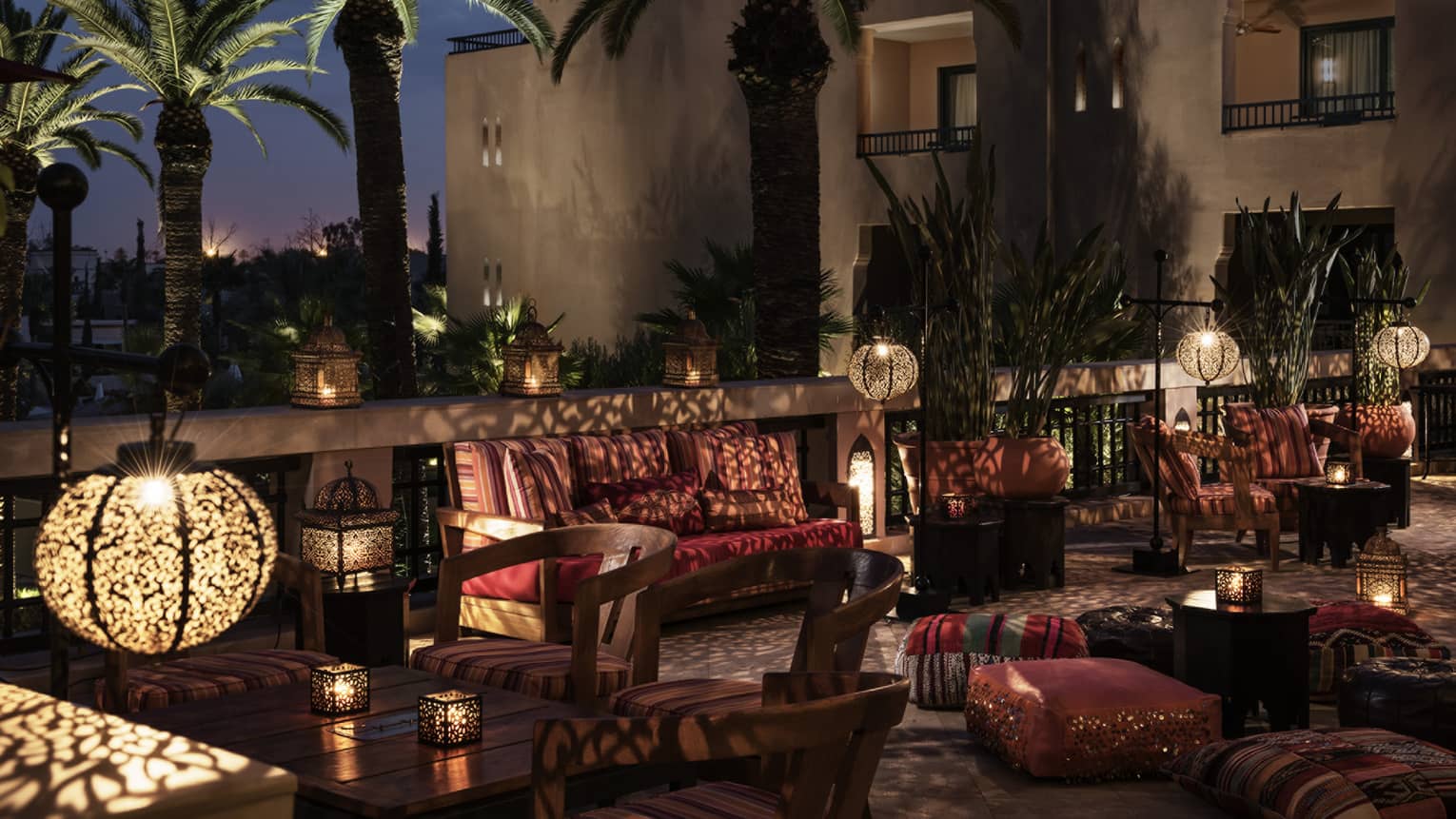 Inara Lounge dimly-lit patio seating areas with lights, shadows from Moroccan lamps