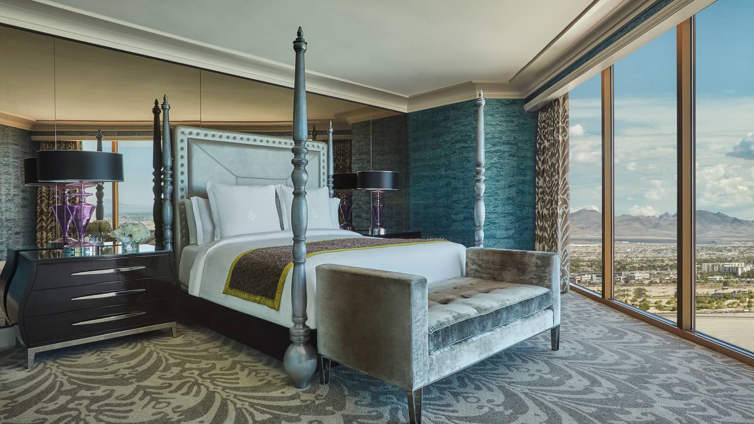 Presidential Strip-View Strip poster bed against mirror wall, grey velvet chaise, floor-to-ceiling windows
