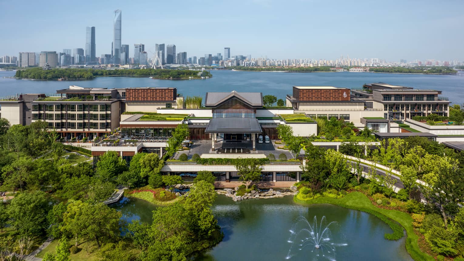 Exterior of Four Seasons Hotel Suzhou, with Jinji Lake and city centre in the background