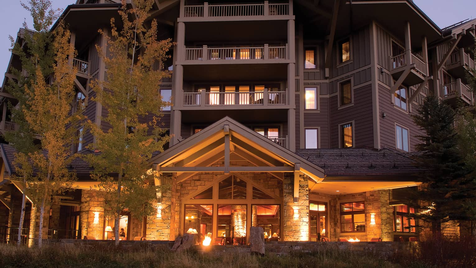 West side exterior view of Four Seasons Resort Jackson Hole at dusk