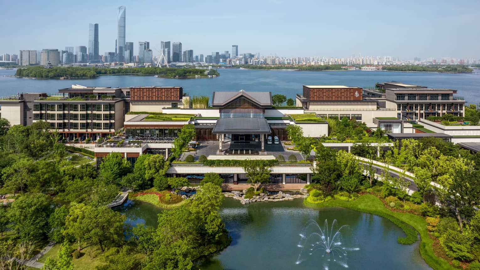 Exterior of Four Seasons Hotel Suzhou, with Jinji Lake and city centre in the background