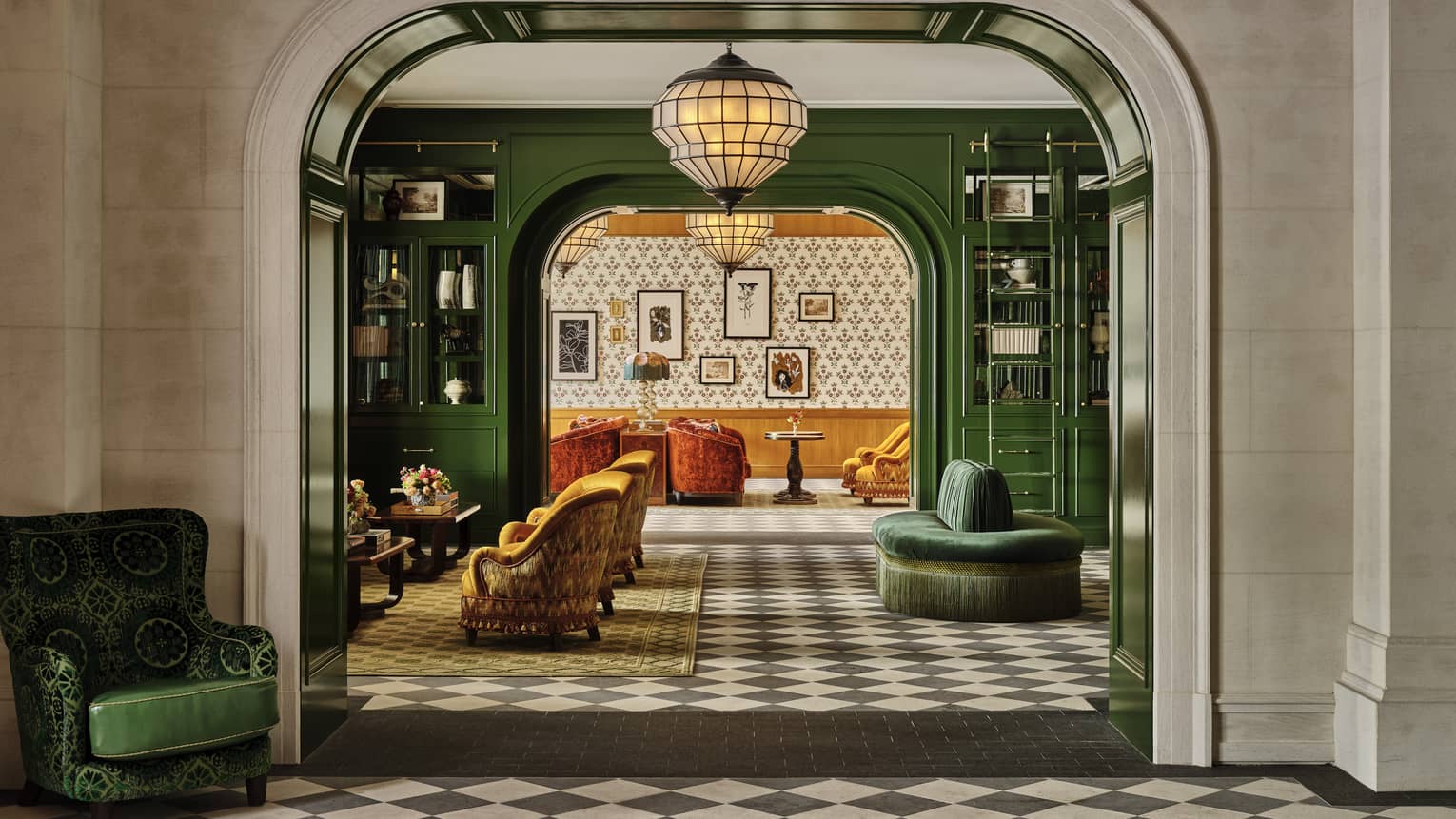 A lobby area with checkered floors and colourful seats.