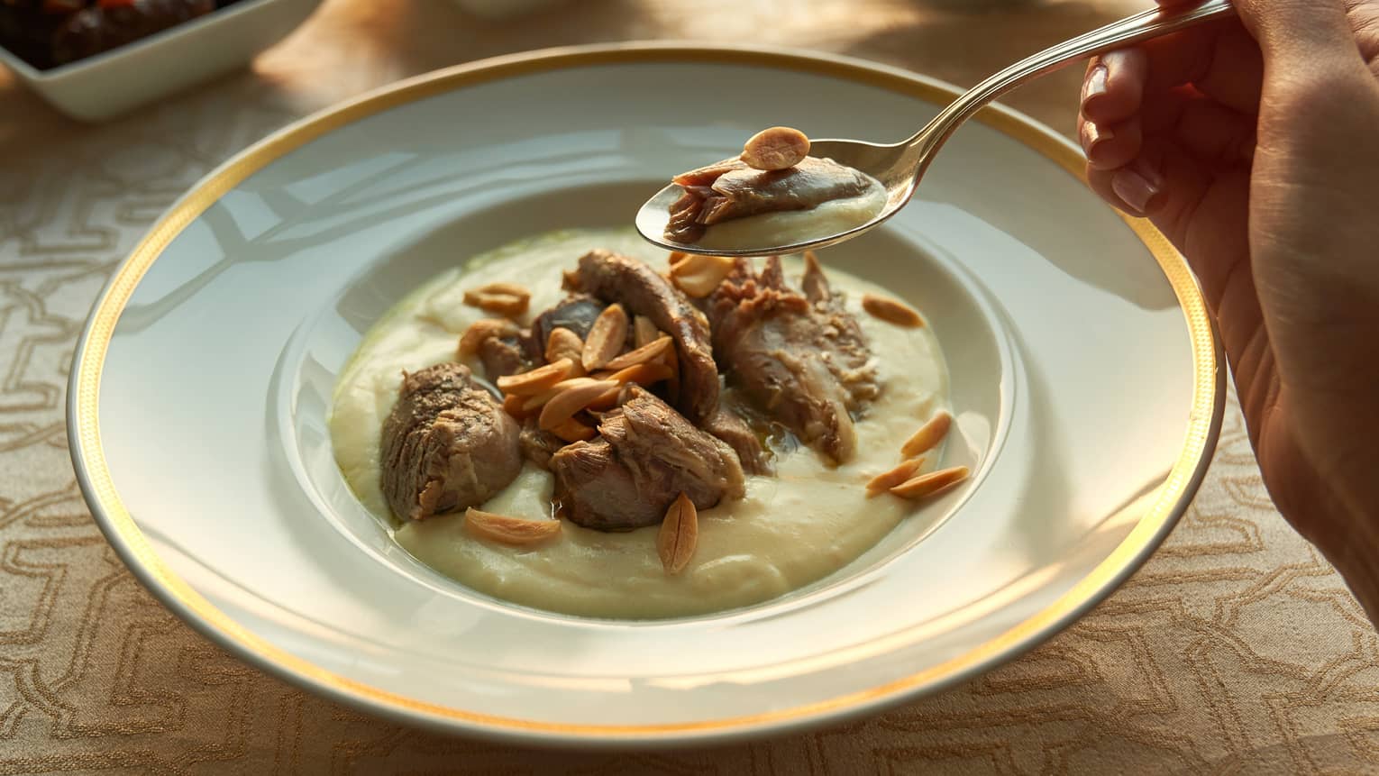 Traditional Egyptian porridge with lamb and slivered almonds