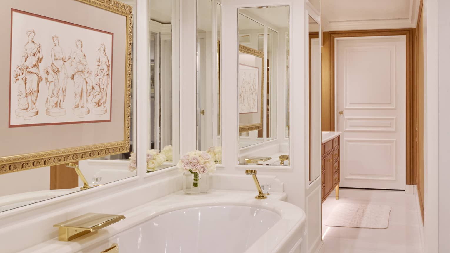 Elegant bathroom with artwork over the tub