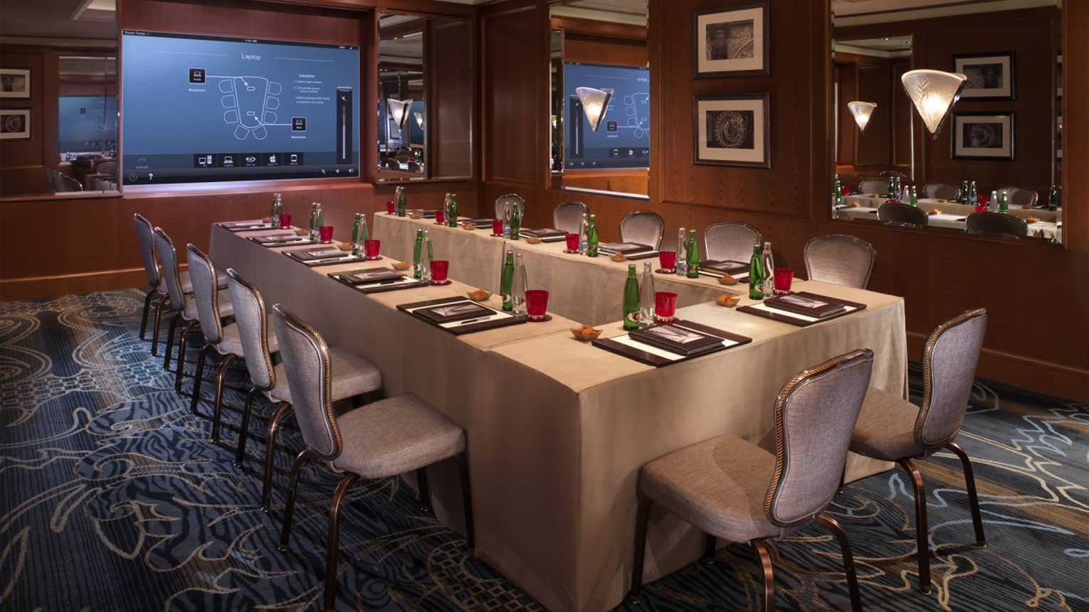 Modular table facing screen in Marketa Meeting Room