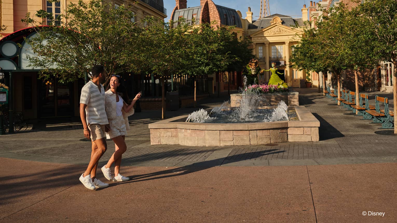Couple walks hand in hand through Epcot