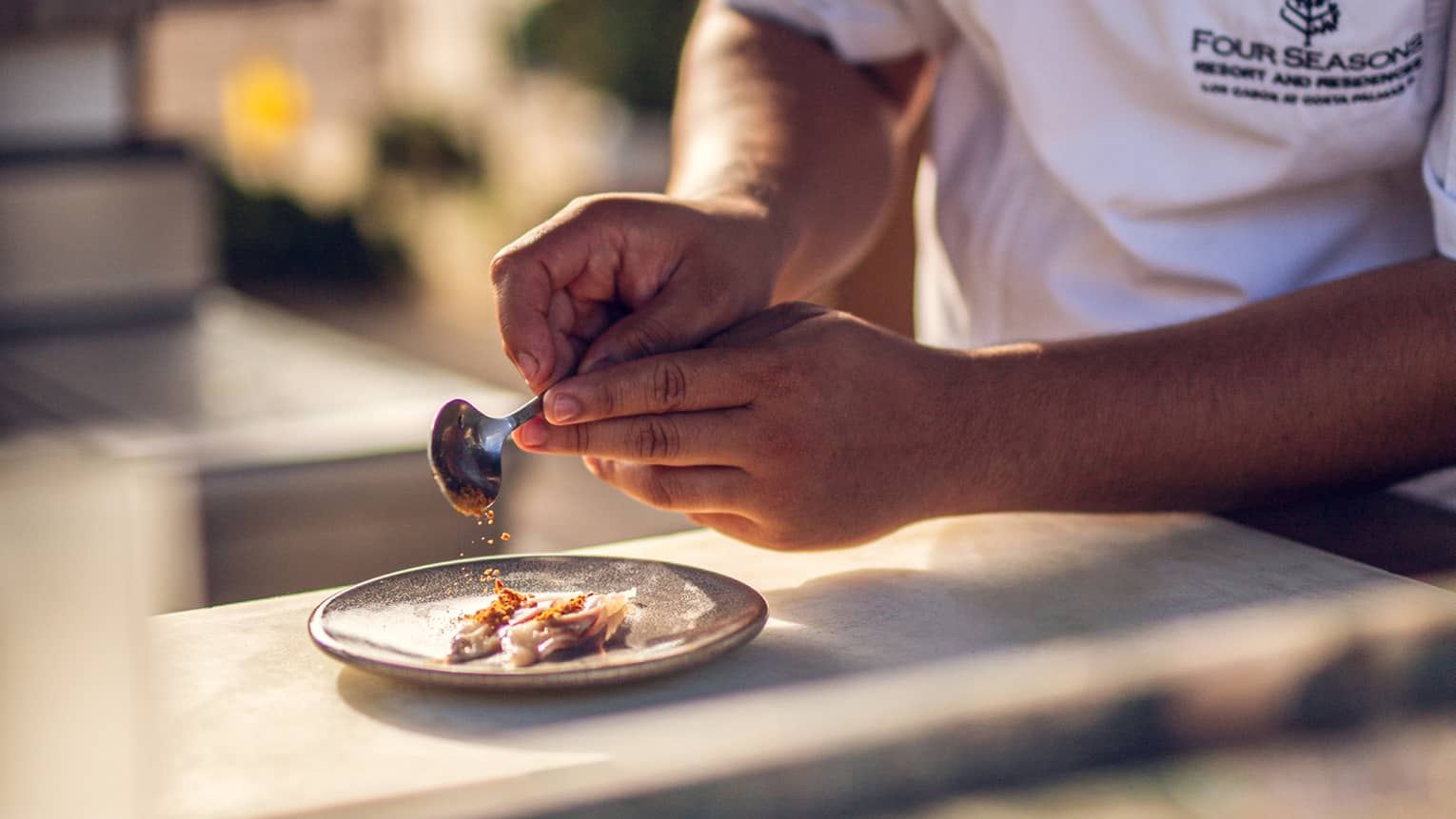 A chef prepares sashimi