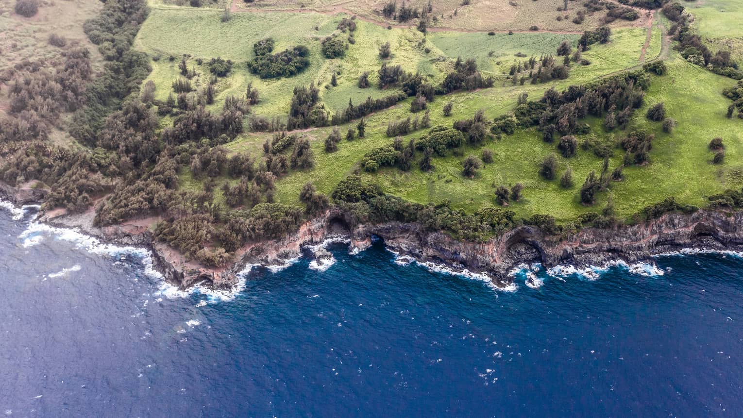Aerial view of Hualalai, Hawaii rocky shoreline and ocean