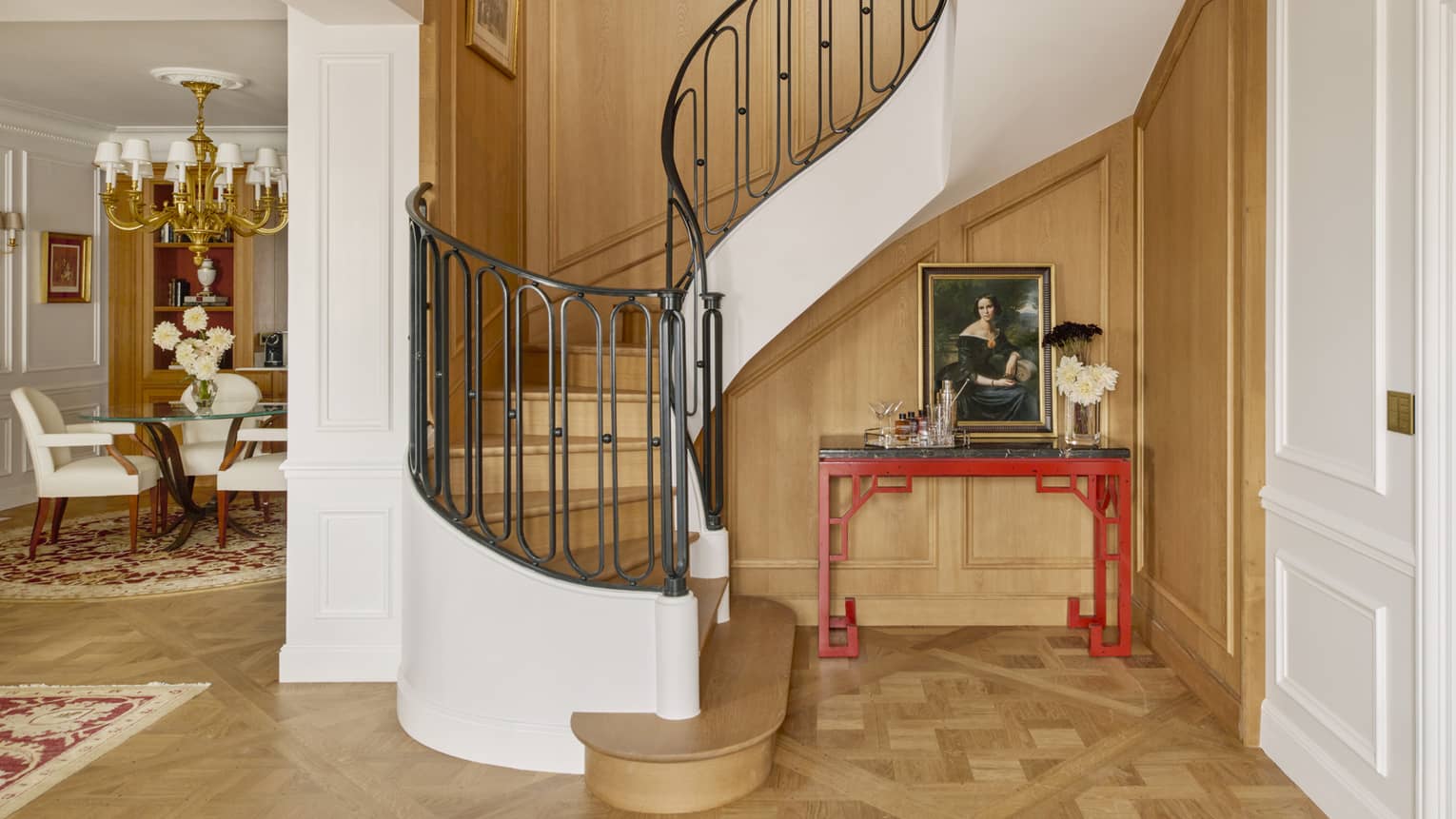 Foyer area, curved staircase leading to upstairs