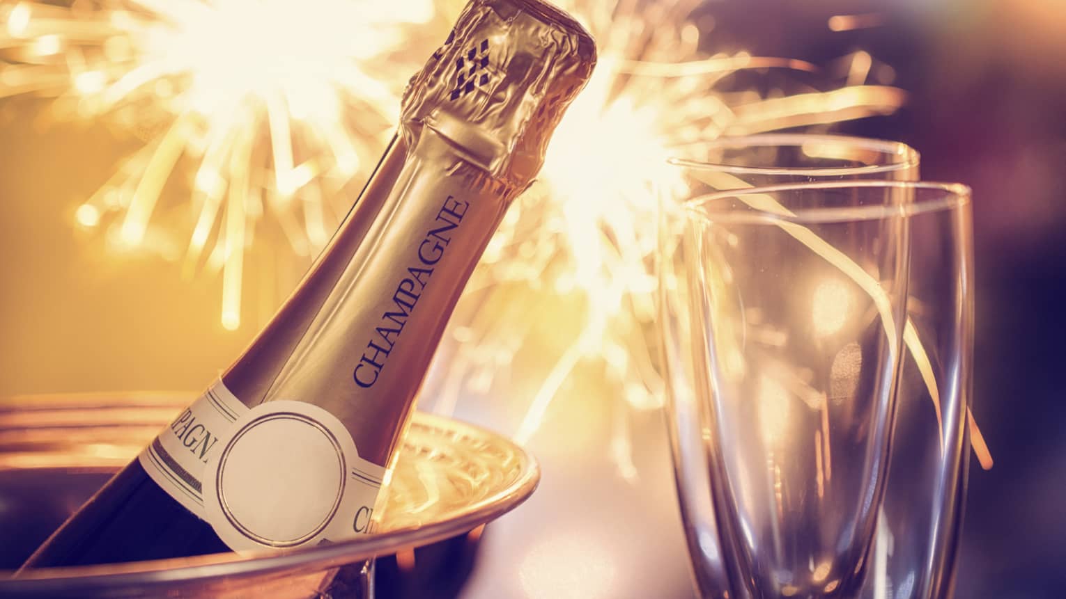 Fireworks, champagne and two champagne flutes