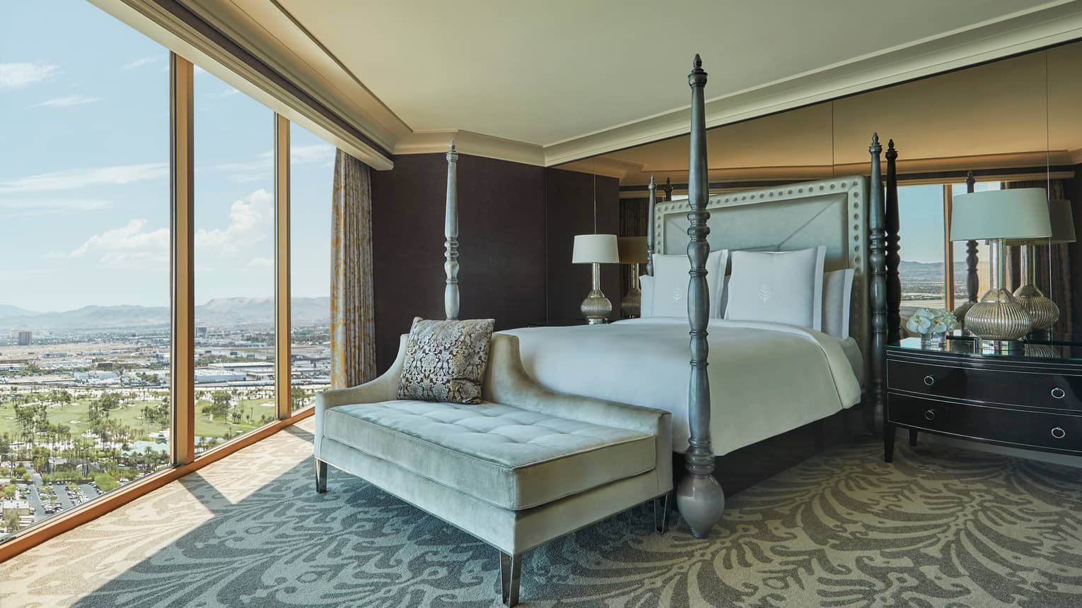 Sunrise Sunset Suite poster bed, tufted bench at foot, floor-to-ceiling window