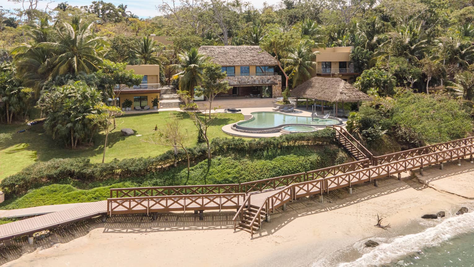 Aerial view of residence, pool and boardwalk