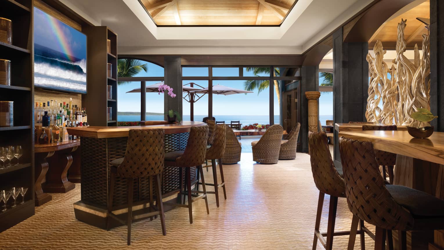 Views Restaurant small wicker bar, bucket chairs in open-air lounge