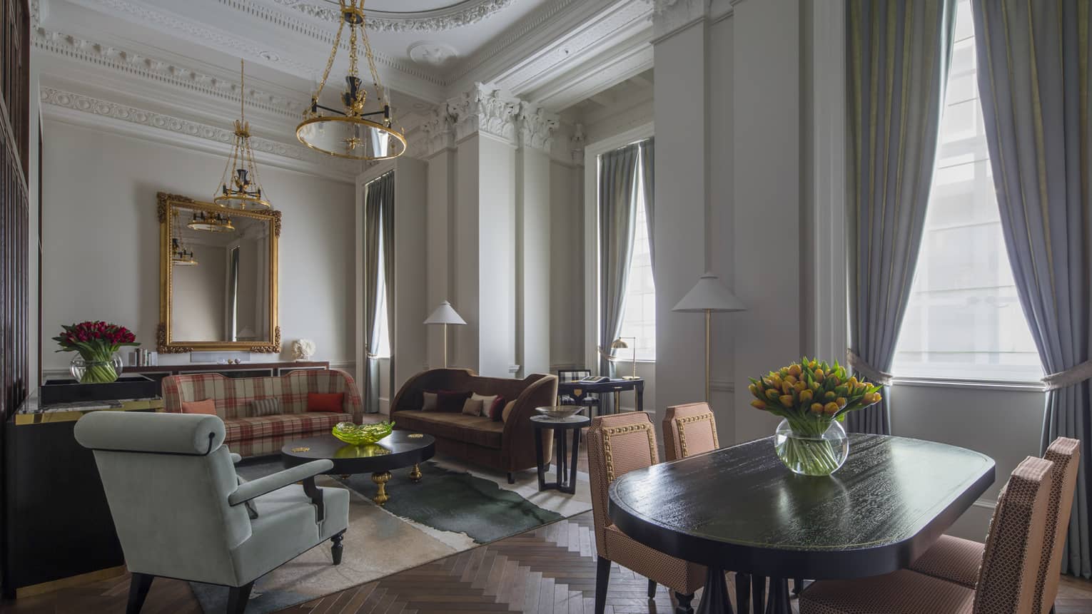 Heritage Suite dining table, seating area by tall, sunny windows 