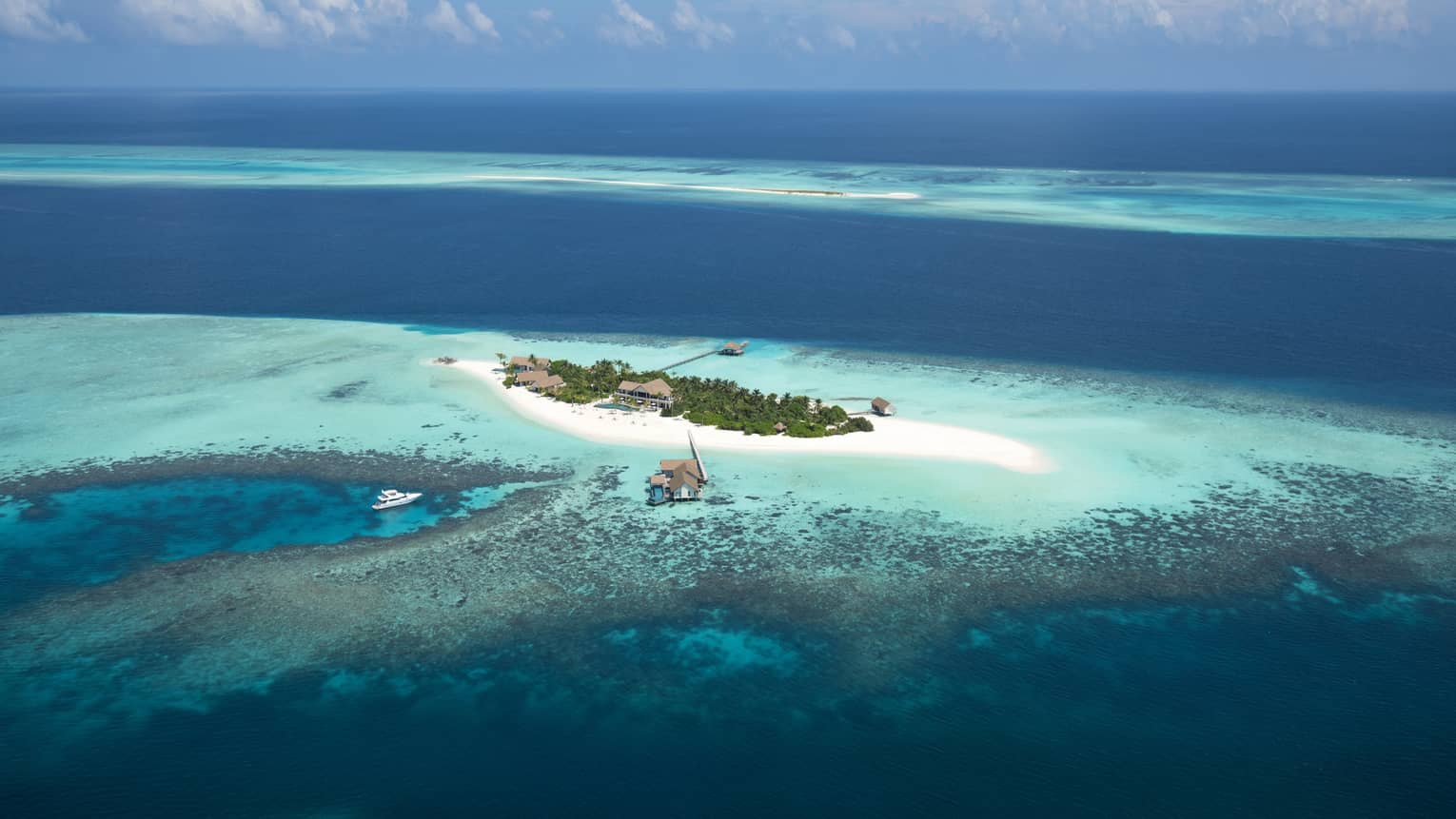 Voavah private island in the bright blue ocean