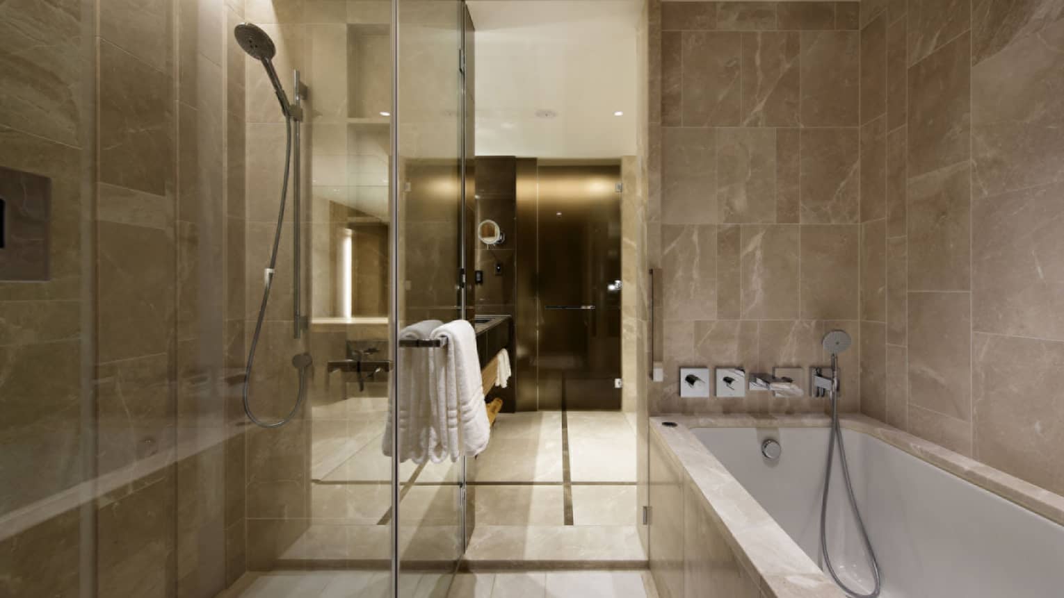 Bathroom with walk-in glass shower and separate tub