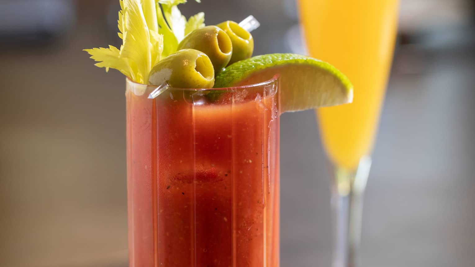 A red and orange cocktail.